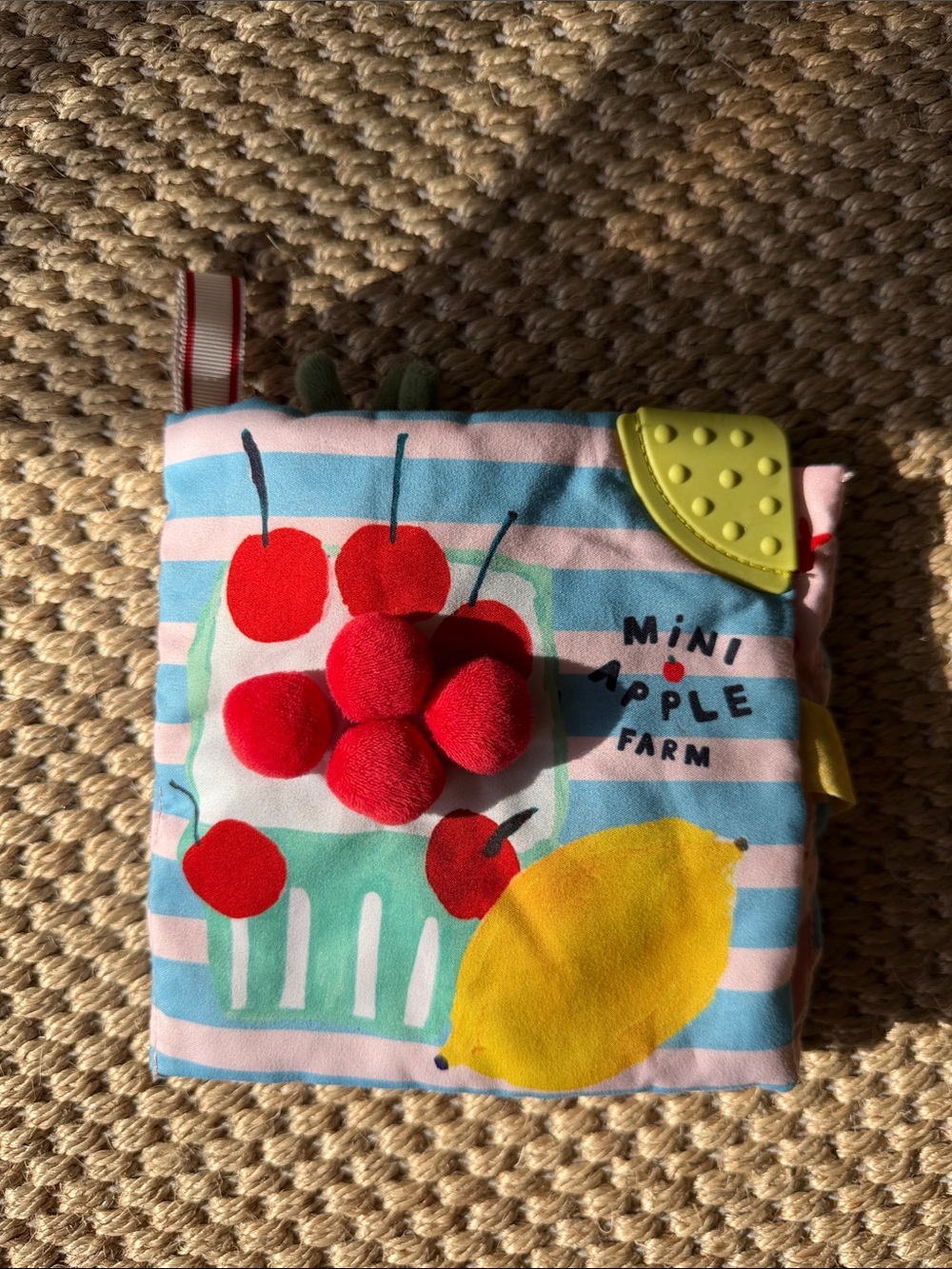 Mini Apple Farm Soft Sensory Cloth Book - Blue, Pink, Red, Yellow